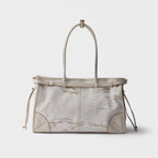 Prada Bonnie large printed linen and leather handbag
